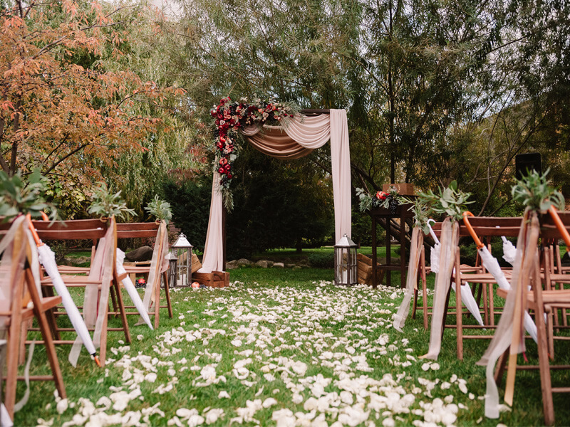 Rustic Wedding Ceremony Décor With Fabric, Ribbons, Garlands, Florals, Petals, Lanterns, & Candles 