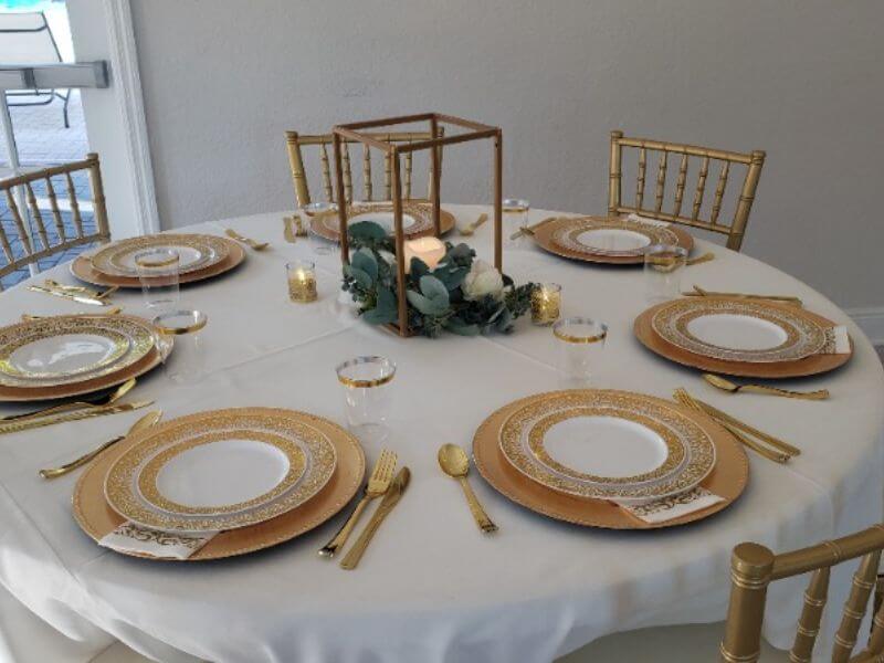 Classy Table Decor With Tablecloth, Chargers, Plates, Napkins, Flower Stand, Leaf Garland, & Candles