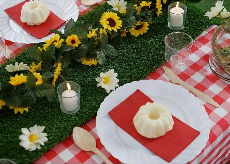 Vibrant Backyard Table Settings With Table Linens, Sunflower Garland, Daisies, Candles & Napkins