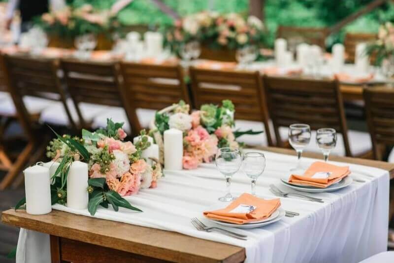 Charismatic Event Table Setup Using Fabric, Napkins, Candles, Peony & Hydrangea Flowers 