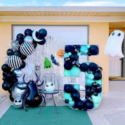 Spooktacular Halloween Themed Birthday Party Décor With Curtains, Balloons, Arch Stand, & Grass Rugs