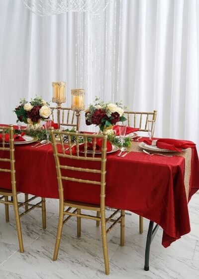 Christmas Dinner Setup With Curtains, Beaded Curtains, Tablecloth, Runner, Floral, & Candle Display
