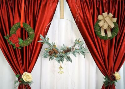 Delightful Christmas Backdrop Décor Using Hoop, Wreaths, Florals, Curtains, Fairy Lights, & Ribbons