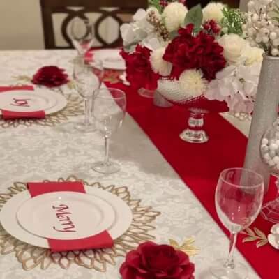 Exquisite Holiday Table Setup With Table Linens, Flowers, Vases, Placemats, And Napkins