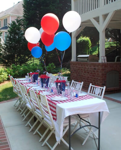 Colorful 4th of July Party Décor with Tablecloth, Helium Balloons, Glass Bottles & Disposable Plates