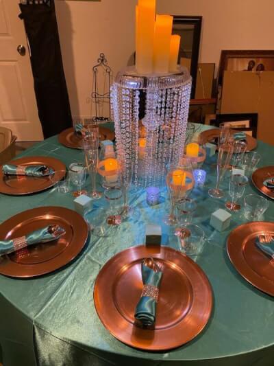 Mesmerizing Table Setup With Tablecloth, Chandelier Stand, Vases, LED Candles, Chargers & Napkins
