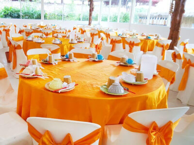 Bright & Beautiful Orange & White Themed Party Setup With Tablecloth, Chairs Covers, & Sashes
