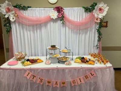 Pretty Baby Shower Setup With Table Linens, Banner, Curtains, Vines, Giant Paper Flowers & Serveware