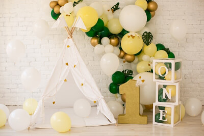 1st Birthday Party Backdrop With Curtain, Feathers, Monstera Leaves, Balloon Boxes, & Balloon Garlan