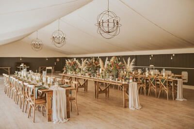 Country-Themed Wedding Décor With Runner, Napkins, Vases, Candles, Flowers, & Pampas Grass Stems