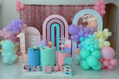 Pretty Birthday Setup With Curtains, Balloons, Display Boxes, Apothecary Jars, & Flowers