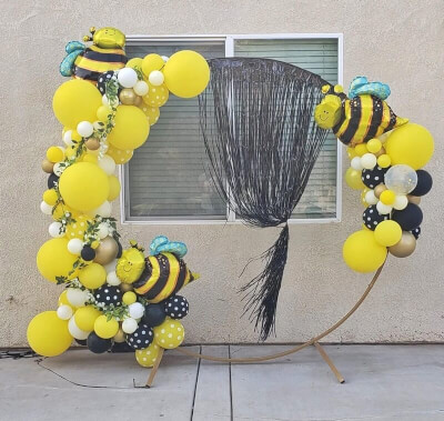 Sweet Bumble bee Party Décor with Metal Arch, Fringe Foil Curtains, & White Peony Flower Garland