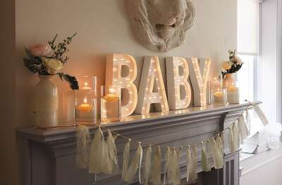 Intimate Baby Shower with 3D Letters, Candles, Glass Vases, Silk Flowers, and Paper Fringes