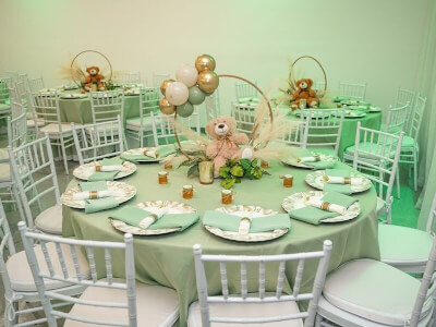Simple Indoor Child’s Birthday Setup Using Tablecloth, Table Napkins, Plush Toy, Metal Hoops & Pampa