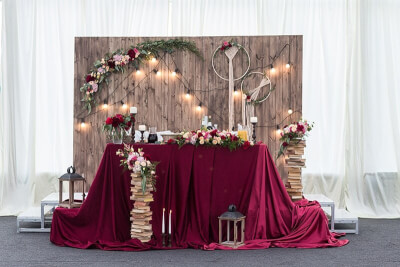 Regal Wedding Table Setup Using Tablecloth, Vinyl Backdrop, Flowers, LED Lights, Lanterns & Candles