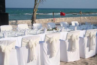 Exhilarating Beach Banquet Setup Using Tablecloth, Chair Covers, Chair Sashes & Cloth Napkins