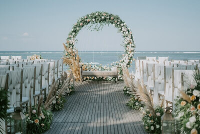 Charismatic Beach Wedding Décor With Arch, Sashes, Lantern, Pampas, Greenery, & Flower Garland