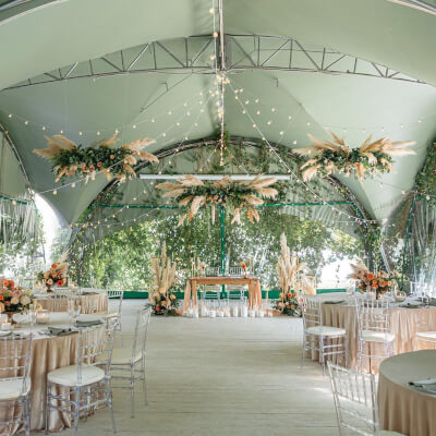 Mesmeric Rustic Wedding Decor With String Lights, Tablecloth, Chairs, Pampas, Candles, & Flowers