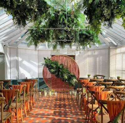 Rustic Greenery Wedding Decor With Arch, Curtains, Tropical Leaves, Vases, Candles, Sashes, & Foliag