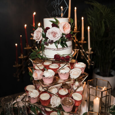 Exquisite Wedding Cake Table With Candles, Flower Garland, Geometric Cake Stand & Candle Holders