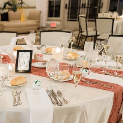 Urbane Tablescape With Tablecloth, Runner, Napkin, Favor Box, Cutlery, Flutes, Geometric Centerpiece