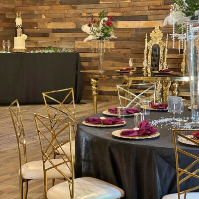Exotic Wedding Decor With Tablecloth, Vase, Chargers, Napkins, Feathers, Number Holder, & Floral