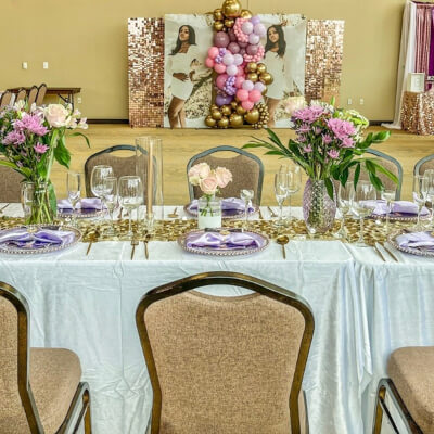 Refined Indoor Wedding Reception Using Tablecloths, Flowers, Wedding Arch, Curtains & Balloons