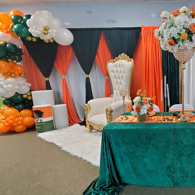 Vibrant Indoor Birthday Setting Using Curtains, Metal Arch, Tablecloth, Flowers & Balloons