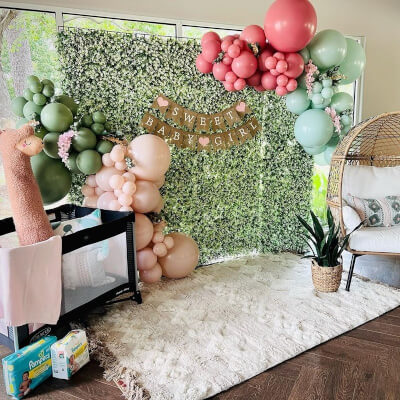 Blissful Girl Baby Shower Decor With Grass Panels, Plant Basket, Wisteria Vines, & Balloon Garland