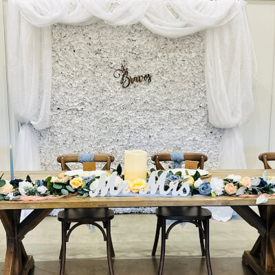 Simple Wedding Couple’s Banquet Using Drapes, Flower Mat, Flowers, Candles & Chair Sashes
