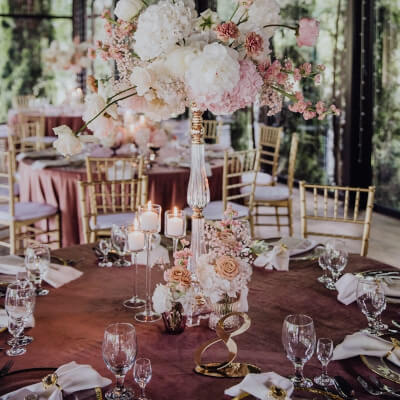 Chic Table Décor With Tablecloth, Napkins, Chargers, Cutlery, Flowers, Vases, Candles, & Chair Pads