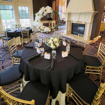 Elegant Wedding Table Setup Using Tablecloth, Cloth Napkins, Cushions, Flowers & Favors