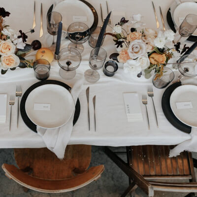 Delightful Table Setup Using Table Linens, Flowers, Vases, Candles, Placemats, Chargers, & Napkins
