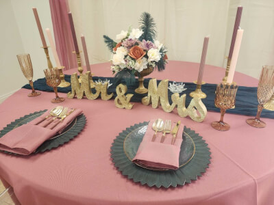 Alluring Table Setup Using Table Linens, Chargers, Napkins, Candles, Candle Stands, Flowers, & Vase