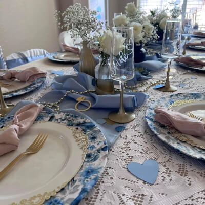 Elegant Table Setup Using Table Linens, Flowers, Vases, Napkins, Chargers, Chair Covers, & Sashes