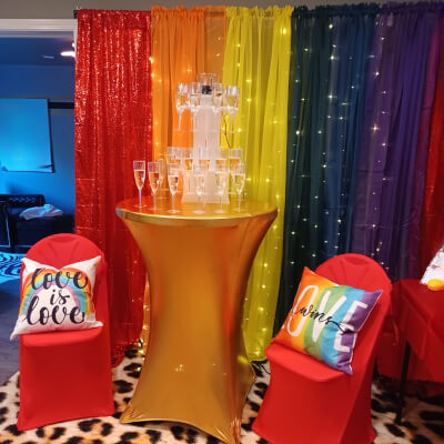 Vibrant Party Décor Using Backdrop Stand, Drapes, Table Cover, Glass Stand, & Chair Covers