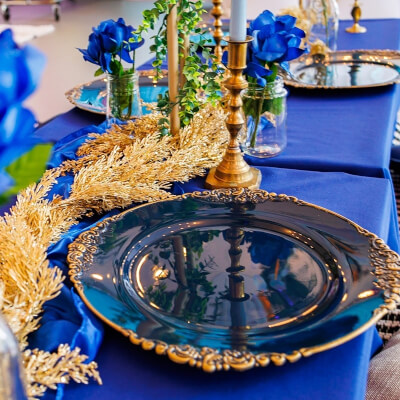 Regal Table Décor Using Table Cover, Chargers, Vases, Flowers, Candles, & Greenery
