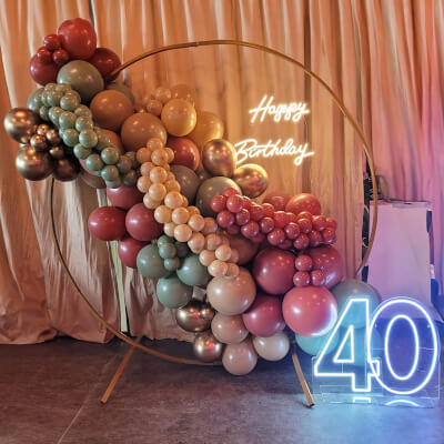 Delightful 40th Birthday Party Backdrop Décor Using Stand, Balloons, & Neon Lights