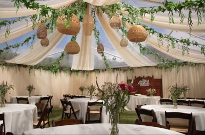 Elegant Party Decor With Draped Ceilings, Greenery Garlands & Fresh Floral Centerpieces