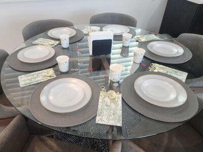 Soft Gray & White Tablescape With Floral Accents, Woven Mats & Coordinated Seating for Any Gathering