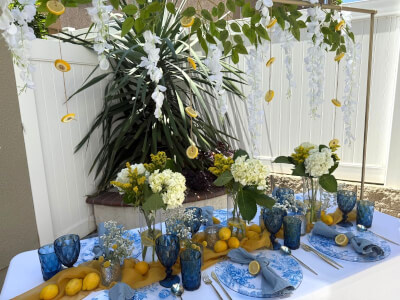 Fresh Yellow & Blue Tablescape With Floral Dinnerware, Lemon Accents & Elevated Greenery Decor