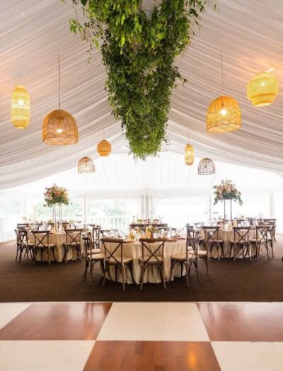 Elegant Tent Reception With Rattan Pendant Lights, Lush Green Ceiling Install & Classic Round Tables