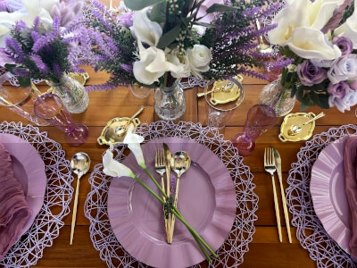 Elegant Purple Tablescape With Geometric Placemats Mats, Gold Cutlery & Cream and Lavender Florals