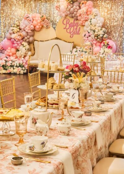 Chic Tea Party Themed Baby Shower with Floral Covers, Sequin Backdrop and Pink Balloons