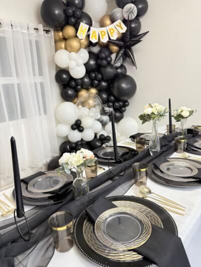 Luxe Black, White & Gold Tablescape with Sheer Runner, Black Candles, and Stylish Balloon Décor