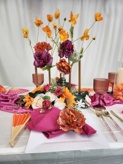 Elegant Autumn Tablescape with Velvet Runner, Bold Napkins, and Floral Centerpiece