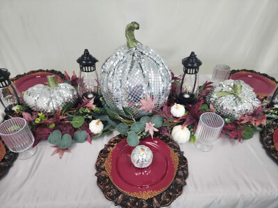 Festive Fall Tablescape with Sequin Pumpkins, Burgundy Plates, Ornate Chargers, and Seasonal Foliage