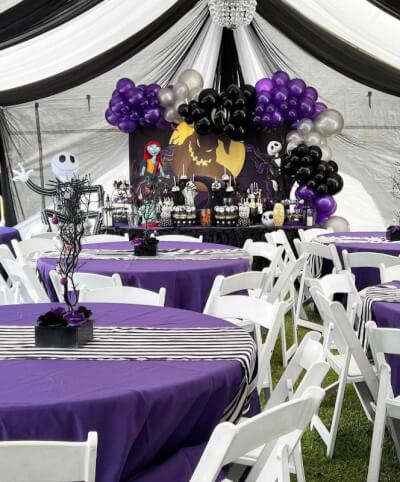 Nightmare Before Christmas Party with Purple Table Covers, Striped Runners, and Balloon Backdrop