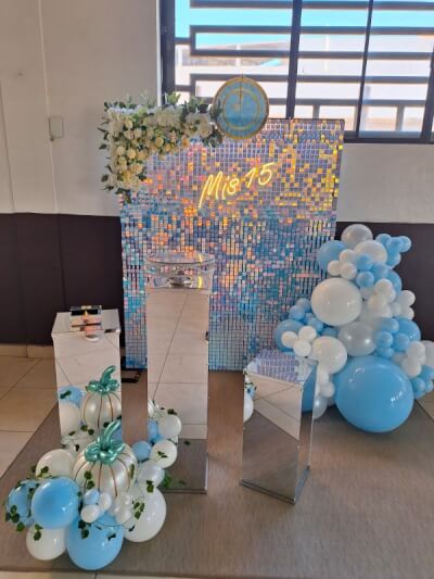 Cinderella-Inspired Quinceañera with Sequin Backdrop, Blue and White Balloons, and Mirrored Pedestal