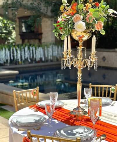 Capturing Romantic Beauty with White Dinnerware, Gold Accents & an Orange Table Runner